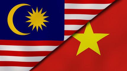 The flags of Malaysia and Vietnam. News, reportage, business background. 3d illustration