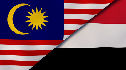 The flags of Malaysia and Yemen. News, reportage, business background. 3d illustration