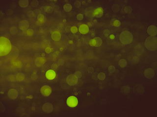 Bokeh lights effect isolated on black background. golden bokeh confetti and spark overlay texture.
