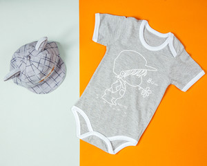 baby boy onesie with short sleeves and grey checked cap with cat ears
