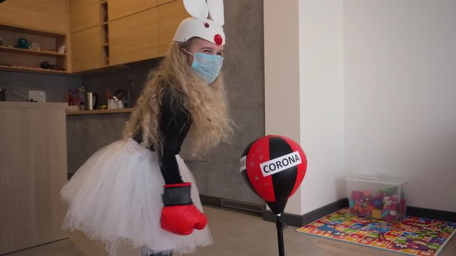 Active girl with bunny costume fighting corona virus covid-19 concept.