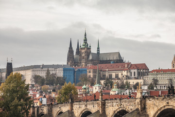 Panorama of the Old Town of Prague, Czechia, with Hradcany hill, Prague Castle,St Vitus Cathedral (Prazsky hrad) and Charles Bridge (Karluv Most) seen from the Vltava river. 