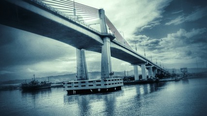 Low Angle View Of Bridge Over River Against Sky