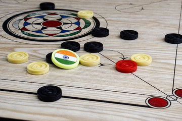 Close-up Of Carrom Coins On Board