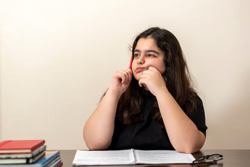 13 years old girl doing homework	