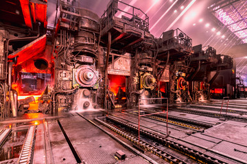 Workshop for rolling hot hoists through rolling mills. For receiving rolled steel and shipping finished products to the consumer at a metallurgical plant. © Aleksandr