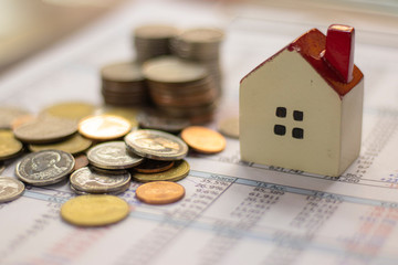 planning savings money of coins to buy a home concept for property
