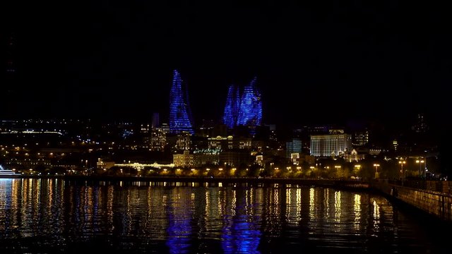 Baku, Azerbaijan - July 2019: Flame Towers in night cityscape. The facades of Flame Towers function as large display screens with the use of more than 10,000 high-power LED luminaires