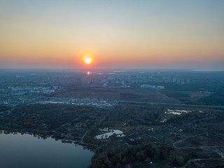 Sunset over the lake in the Kiev city. Aerial drone view.