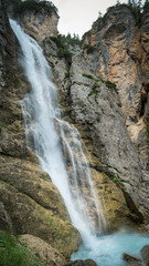 Fototapeta premium Waterfall in the Dolomite Mountains