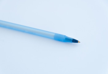 Blue plastic pen isolated on the white background. Close up