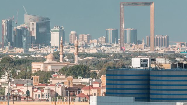 Skyline of the city with modern skyscrapers in Deira znd Zabeel district and blue sky on a sunny day aerial timelapse from Business Bay, Dubai, United Arab Emirates