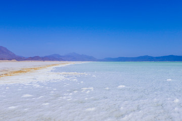 Close up view to the Salt pieces on the Coast line of the Lake Assal, Djibouti