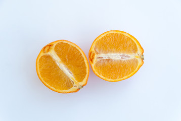 Two halves of an orange isolated on a white background. Top view