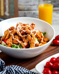 caesar salad with chicken nuggets