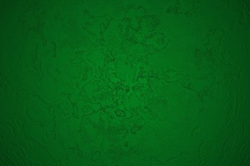 Fragment of a plastered dark green wall.