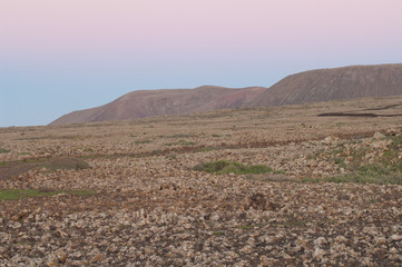 Plain and hills in Majanicho at sunset. La Oliva. Fuerteventura. Canary Islands. Spain.