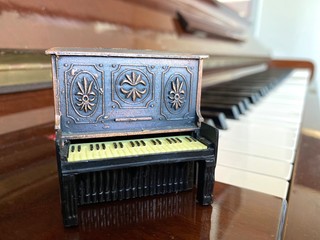 miniature piano and acoustic piano