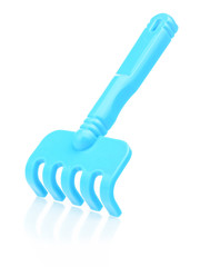 Children's blue plastic rake on a white background. Rake for playing in the sandbox, close-up. Catalog of children's toys. Educational games for children