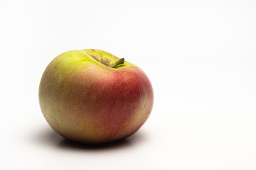 A ripe Apple shot from the side on a white background