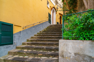 Fototapeta na wymiar Narrow stairs and streets in the tourist village of Positano, Amalfi coast