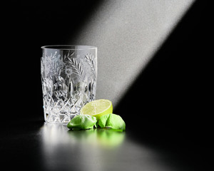 Crystal glass for homemade cocktails with lime and basil