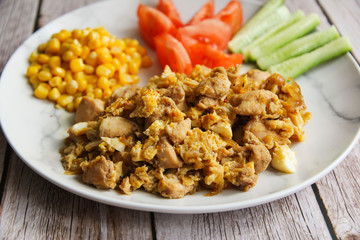 Chicken with o scramble, fresh cucumbers and tomatoes and corn