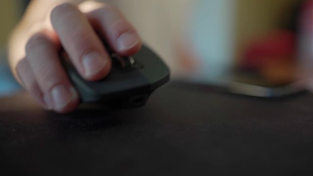 clicking, scrolling and using a logitech MX master 2s wireless computer mouse.