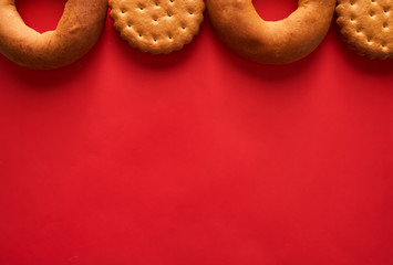 cookies and bagels on a red background advertising banner with the ability to insert text