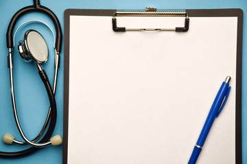 Stethoscope and clipboard on a blue background