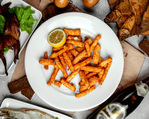 crispy fried cheese strips garnished with lemon