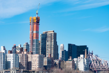 Fototapeta na wymiar Midtown Manhattan Skyline in New York City with the Queensboro Bridge and Construction