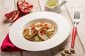 artichoke ravioli with pomegranate and parmisan flakes