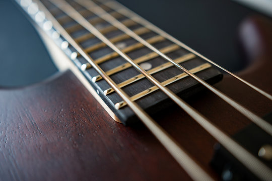 Brown four string bass guitar  picture in shallow depth of field