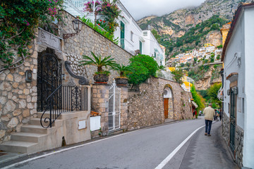 Typical narrow street and colorful houses in city of Positano, Amalfi coast