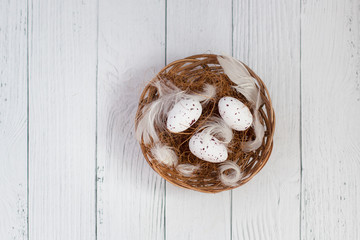 quail eggs in a straw basket