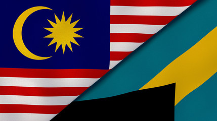 The flags of Malaysia and Bahamas. News, reportage, business background. 3d illustration