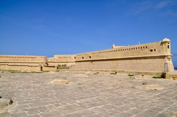 Fort Saint Elmo  is a star fort in Valletta, Malta. It stands on the seaward shore of the Sciberras Peninsula that divides Marsamxett Harbour from Grand Harbour, and command the harbour entances.