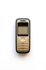 Old cell phone on the white background