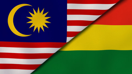 The flags of Malaysia and Bolivia. News, reportage, business background. 3d illustration