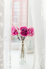 peony wallpaper. peony in a vase on a white background. simple and abstract flower background. close up of pink flowers in vase. white picture of a pink peony bouquet
