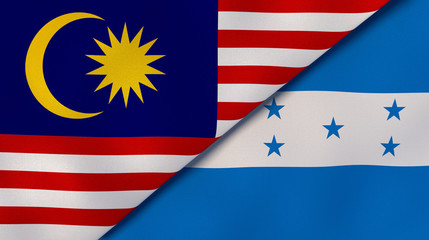 The flags of Malaysia and Honduras. News, reportage, business background. 3d illustration