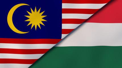 The flags of Malaysia and Hungary. News, reportage, business background. 3d illustration