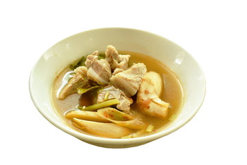 hot and spicy pork bone with tamarind and Thai herbs soup on glass bowl