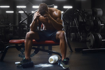 Bodybuilder with scattered protein powder