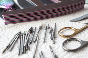 Manicure tool. Used professional tools. A lot of used cutters, pushers, nail files and scissors.