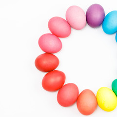 Easter multicolor eggs isolated on a white background. Rainbow. Copy space. Flat lay. Top view.