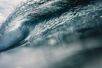 Perfect barrel wave in ocean. Breaking wave with sun light