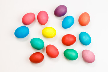 Easter multicolor eggs isolated on a white background. Rainbow. Copy space. Flat lay. Top view.