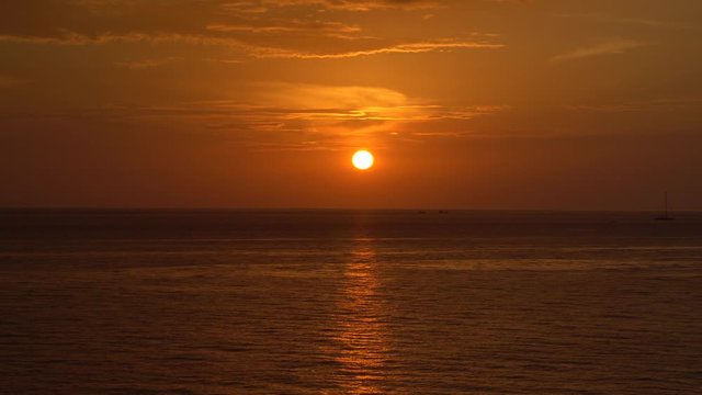 Nature seascape of Tranquil sunset scene. Sun and dark clouds with twilight sky over the sea at phuket Thailand - image backdrop background and copy space                           